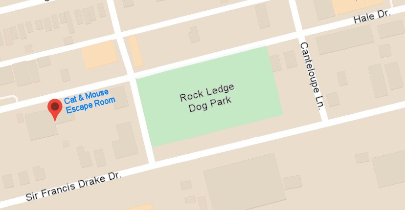 Map with a pin for Cat and Mouse Escape Room on Sir Francis Drake Drive, beside the green block of Rock Ledge Dog Park